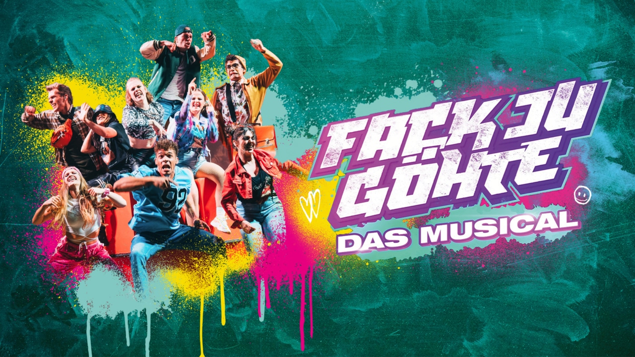 Ensemble des Musicals „Fack Ju Göhte“ vor farbenfrohem Graffiti-Design mit Logo der Produktion.